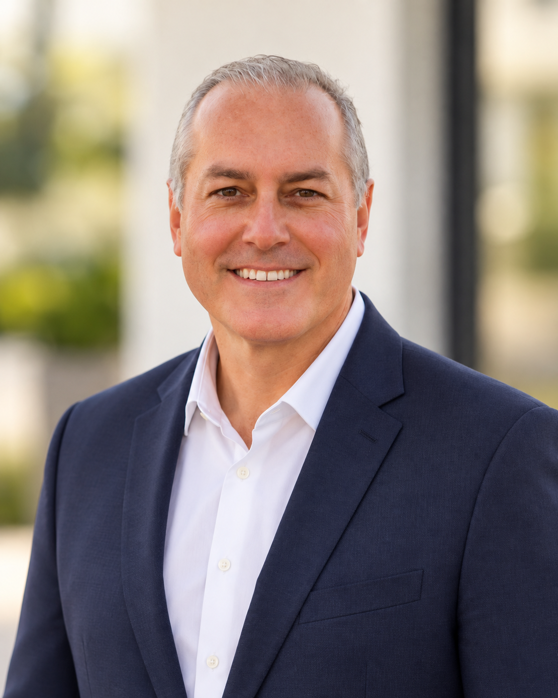 Jared Taylor wearing a navy jacket and white shirt